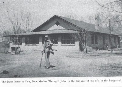 John Dunn standing in front of his home, now Cici's Bean and other shops